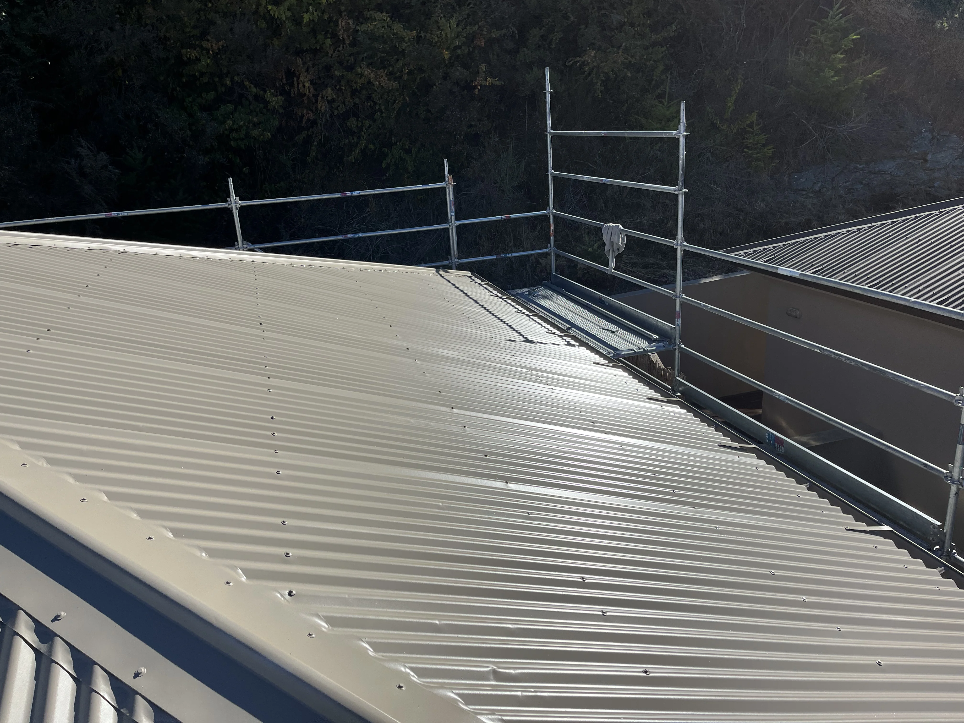 Professional technician applying advanced coating system with specialized equipment