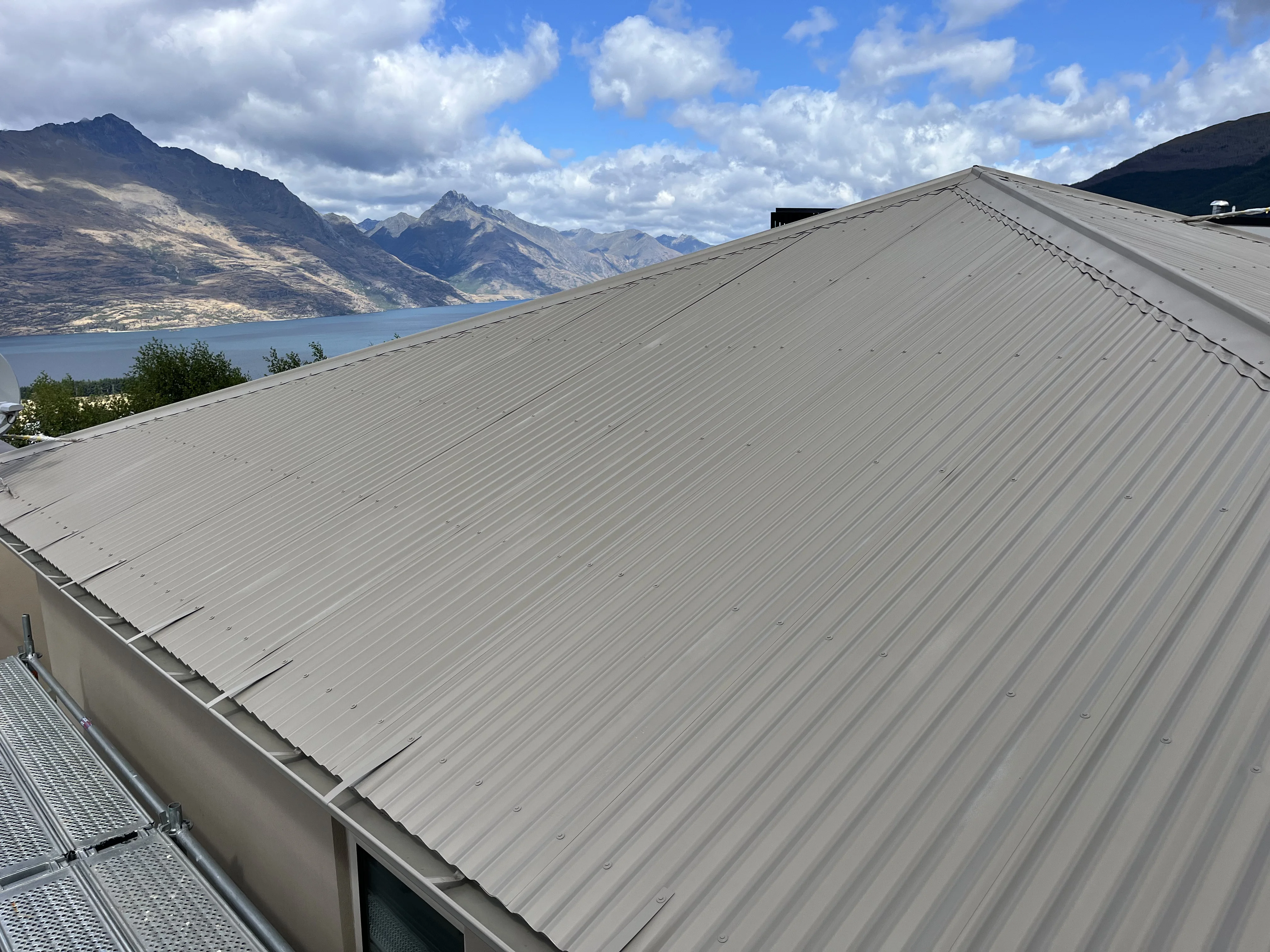 Roof with premium protective coating system deflecting environmental elements